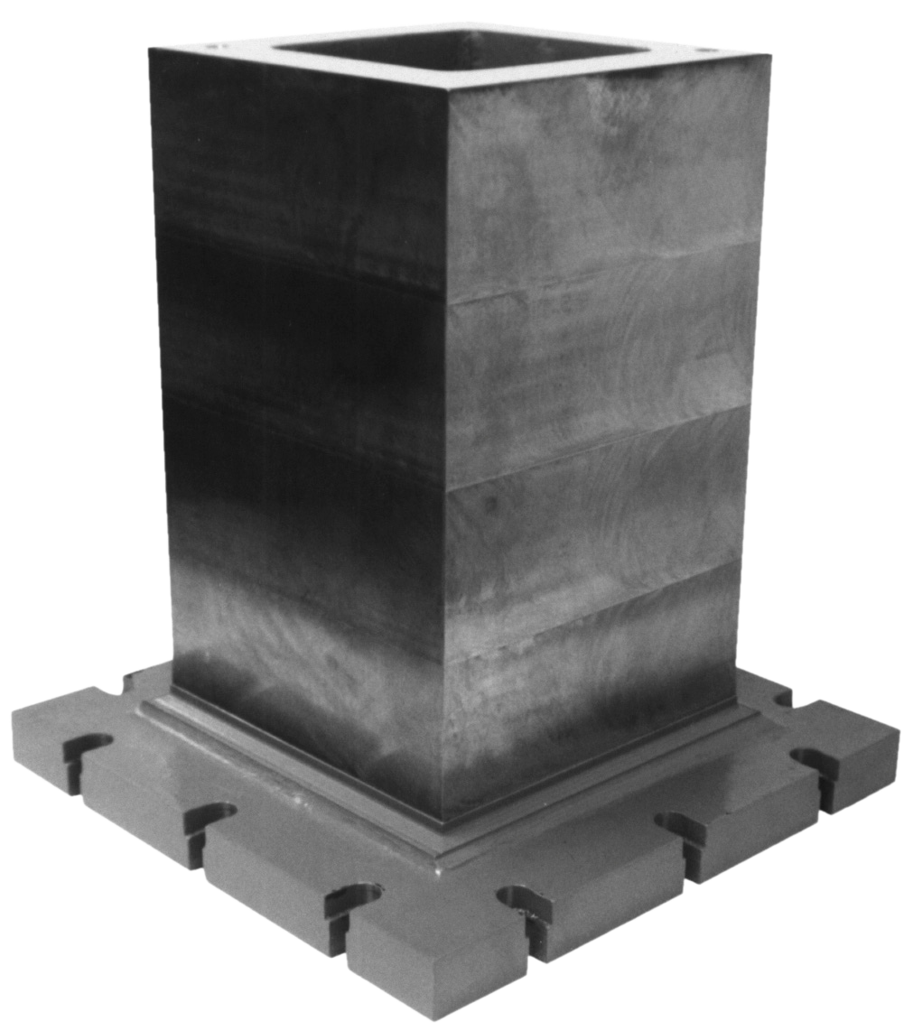 a metal block with a square hole in the middle