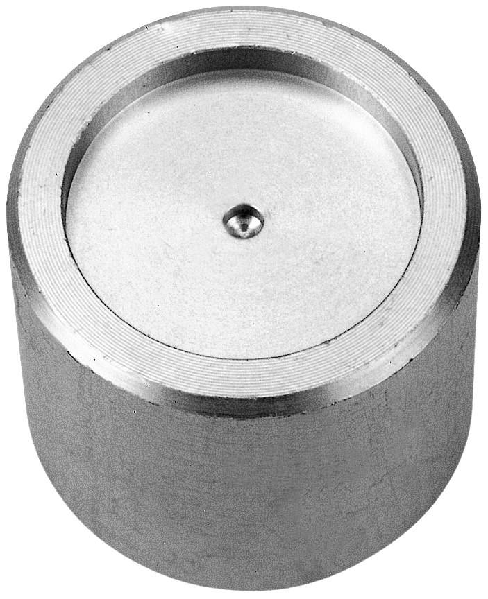 a metal cylinder jig with a hole in the middle